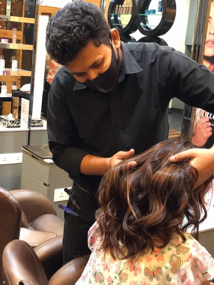 Here I am, adding the finishing touches to this beautiful balayage. I take great care in styling the hair after coloring to ensure the client leaves feeling confident and happy with their new look.