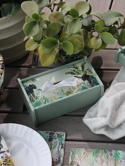 A close-up of our Savanna tissue box, styled on an outdoor deck. This piece shows how even the most practical items can be elevated with beautiful design, contributing to a cohesive decor theme.