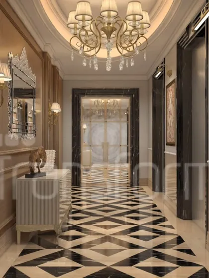 A grand entrance designed to deliver a timeless first impression. The hallway exudes elegance with its bold black and beige geometric marble flooring, warm wooden paneling, and a statement gold chandelier that casts a soft, welcoming glow.
