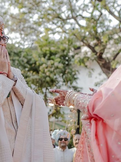 The groom's emotional reaction upon seeing his bride for the first time.
