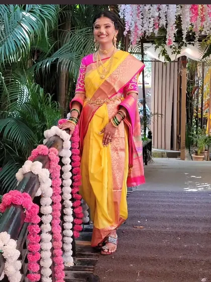 A radiant client in a yellow Navari drape, perfect for a festive occasion. I teach how to select and drape sarees that suit your body type and the event, ensuring you feel confident and beautiful.
