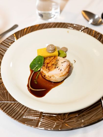 My signature Ballotine of Chicken. The chicken is deboned, stuffed with a mousseline, and served with a classic panisse, truffle mushroom ketchup, and a port wine reduction.
