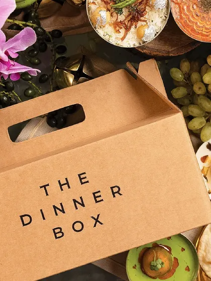 A close-up of our branded Dinner Box, a symbol of the gourmet experience that awaits you.