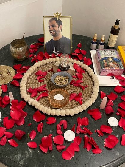 An altar set up for one of our workshops, with rose petals, candles, and crystals. We create these sacred spaces to honor the energy of our gatherings and deepen our connection.
