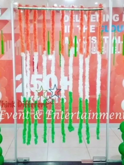 This entrance for an office features tricolor balloon pillars and a curtain of saffron, white, and green streamers, creating a welcoming and festive feel for Independence Day.