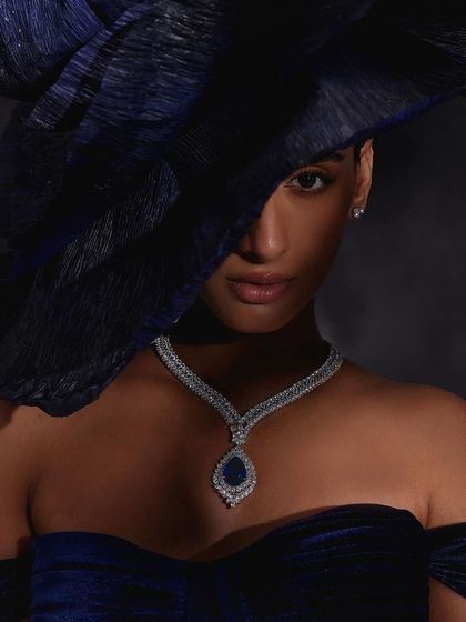 A close, intimate portrait for Purab Paschim, with a hat creating a shadow that frames the face and the brilliant sapphire necklace.