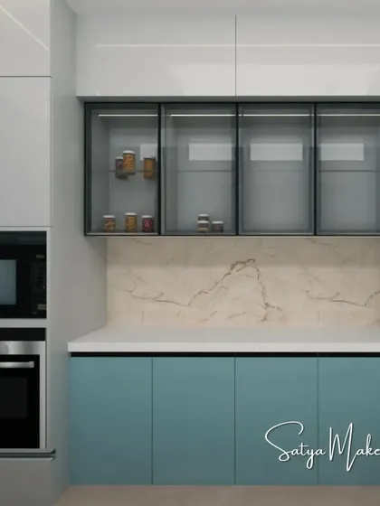 Another view of the pastel blue kitchen concept, focusing on the built-in oven and glass-fronted cabinets.