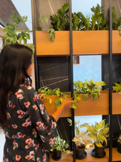 This is my favorite moment in any project. Taking a step back to admire the finished space and seeing the new plant parent so happy with their green wall. We created this beautiful living partition to bring greenery and life right into the center of the home.