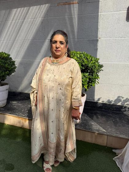 A picture of pure elegance. This client is wearing a custom-tailored suit, and her grace and poise make the outfit shine even brighter. It's all about finding the right silhouette for you.