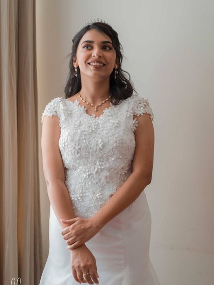 Bride Hannah, glowing for her church wedding. We chose a champagne gold eye, soft pink lips, and a dewy base to create this radiant and angelic look.