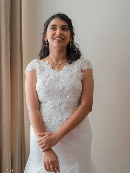 Bride Hannah, glowing for her church wedding. We chose a champagne gold eye, soft pink lips, and a dewy base to create this radiant and angelic look.
