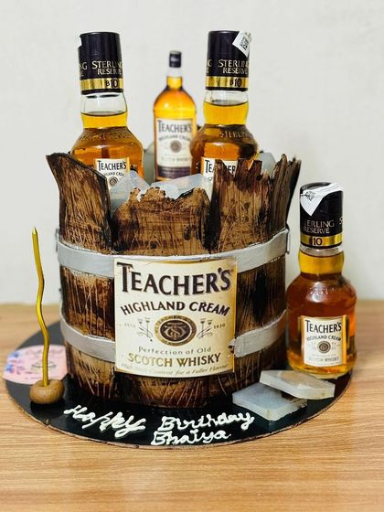 A realistic Teacher's Scotch Whisky barrel cake, a great choice for a whisky enthusiast.