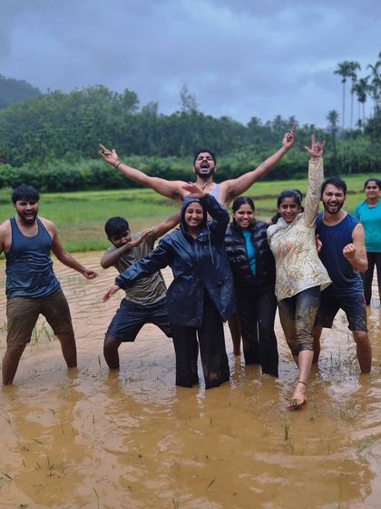 Our group getting playful in the mud, a fun part of the Gangadikal trek experience.