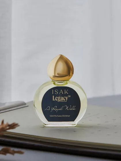 Another composition for Isak Legacy's "A Royal Wyld" perfume oil. This desktop scene with a notebook and soft morning light gives the product a gentle, sophisticated, and personal feel.