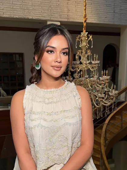 This look focuses on face-framing pieces to soften the pulled-back style, a technique I emphasize for creating personalized looks for clients.