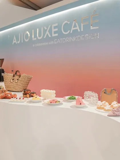 A wide shot of the Ajio Luxe Café counter, displaying a variety of our fashion-inspired treats. The gradient background and clean lines of the counter create a modern, stylish backdrop.