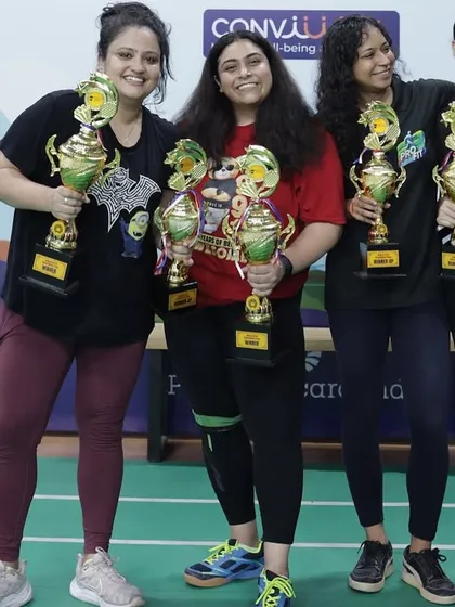 Celebrating the winners of the women's category at the Pernod Ricard India tournament. I ensure our events have diverse categories, including singles, doubles, and mixed doubles, so every employee gets a chance to compete and shine.