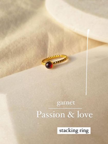 This Garnet stacking ring is small but mighty. Garnet is a stone of passion and love, perfect for revitalizing a connection or sparking a new one. It's a beautiful, minimalist expression of devotion.