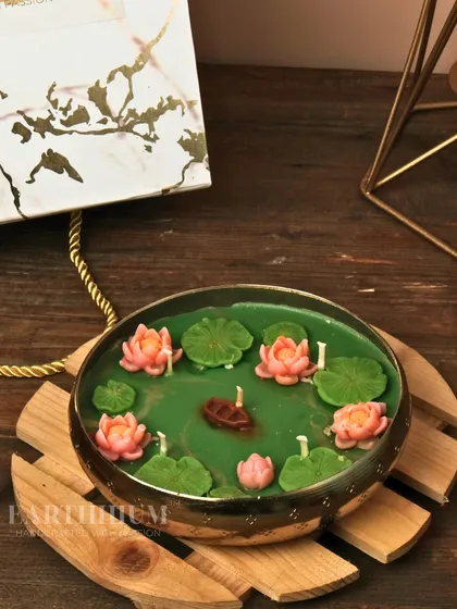 A different angle of the Lotus Pond candle, showing the tiny boat detail that adds a touch of whimsy.