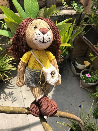 Meet Jireh, the lion, all dressed up and ready for an adventure with his tiny lamb shoulder bag. This is one of my larger dolls, showing the detailed clothing and accessories I can create.