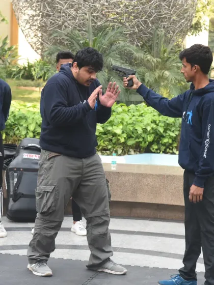 Facing a gun is a worst-case scenario, and we train for it. My technique focuses on one thing: survival. I teach you how to redirect the line of fire, control the weapon, and neutralize the threat with decisive action. This is not a movie scene; it's a critical survival skill.