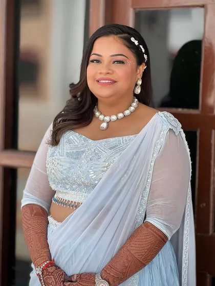 A full portrait of the bride, her outfit and styling perfect for a daytime party.