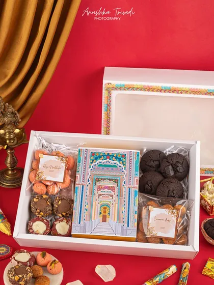 This hamper is all about showcasing a variety of baked goods for Diwali. The open-box styling allows customers to see exactly what they're getting, from cookies to brownies.
