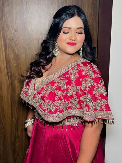 A serene portrait with eyes closed, highlighting the flawless makeup.