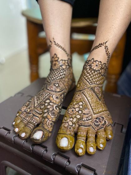 Both feet together, showing the beautiful contrast in design.