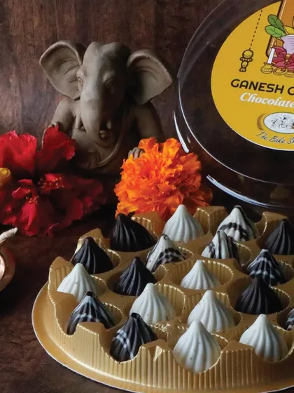 A modern tribute to a festival favorite. Our Chocolate Modaks for Ganesh Chaturthi are handcrafted in an assortment of white, milk, and dark chocolate, making them a beautiful offering for prasad or a delightful gift for loved ones.