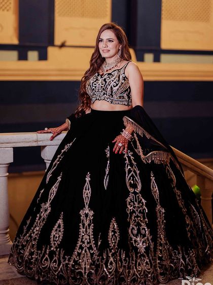 Another angle of this stunning reception look. The soft curls and dramatic makeup create a perfect party vibe.