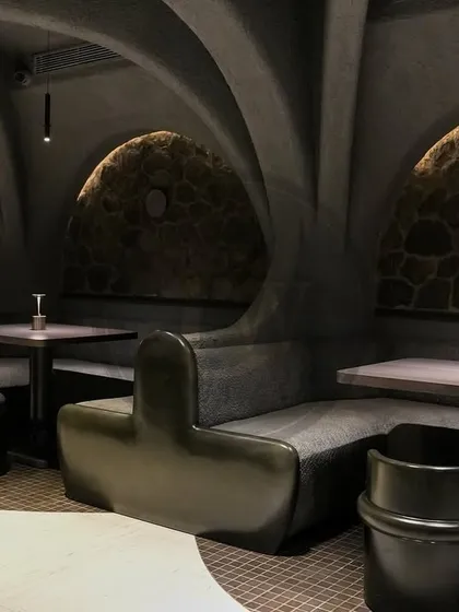 Your theme is our command. The unique, cave-like interior of Call Me Ten required completely bespoke seating solutions. We manufactured these curved booths and chairs to fit the architecture perfectly, creating an intimate and one-of-a-kind fine dining atmosphere.