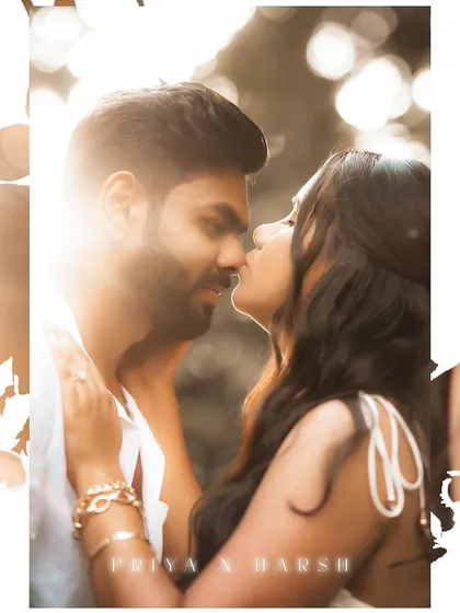 A sun-kissed, romantic close-up of a couple about to share a kiss during their outdoor pre-wedding shoot. The beautiful backlighting creates a dreamy, golden hour effect.