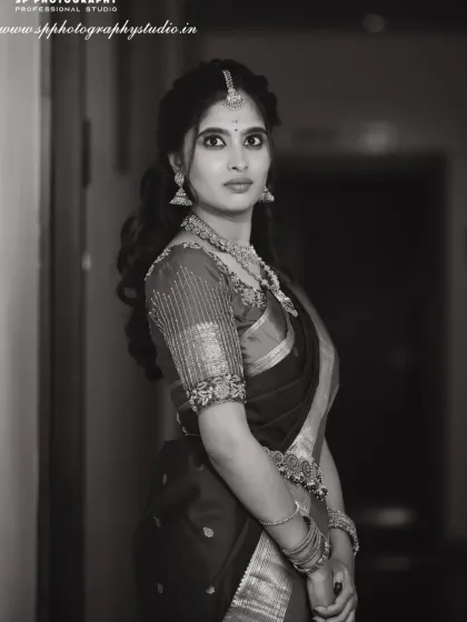 A timeless bridal portrait in black and white. This style strips away color to focus on emotion, expression, and the intricate details of the bride's attire, creating an elegant and classic memory.
