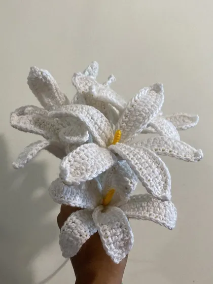 A full bouquet of elegant white crochet lilies. Each petal is carefully shaped to create a realistic and beautiful flower that will last forever.