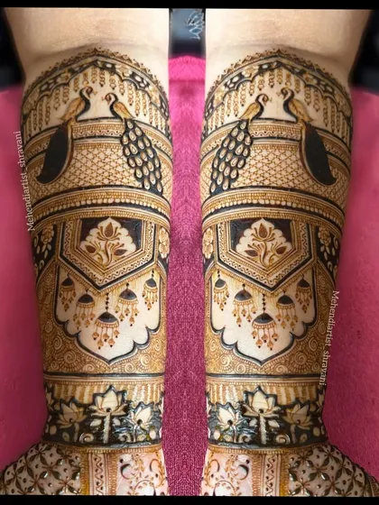 I love creating bold and symmetrical patterns. Here, majestic peacocks are framed by intricate architectural jharokha designs, using dark-fill techniques to make the artwork pop.