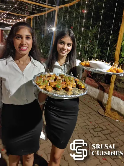 Our welcome hostesses do more than just greet guests; they create a warm and inviting atmosphere from the very beginning. Here, they are serving appetizers with a smile, demonstrating the proactive and friendly hospitality that ensures every guest feels personally attended to throughout your event.