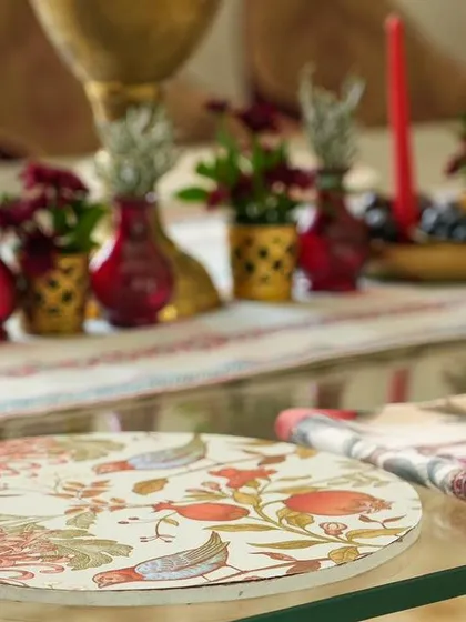 A close-up of the custom-printed placemat and napkin. We explore how to use custom stationery and linens to reinforce your event's theme down to the smallest detail.