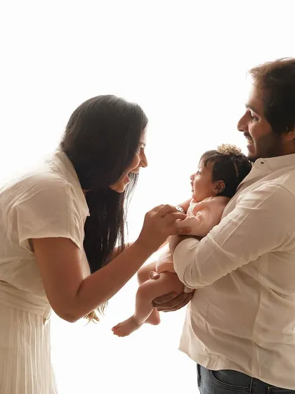 Another angle of the family playing, showing the genuine smiles and connection. My goal is to make you forget you're in a photoshoot and just enjoy the moment.