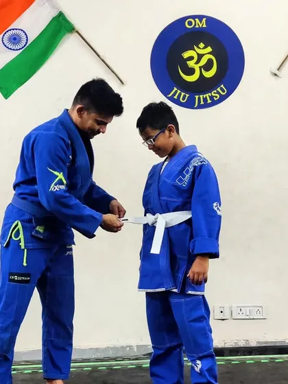 Tying the stripe for another one of our dedicated students. His focus and hard work have paid off, and this is just the beginning for him.