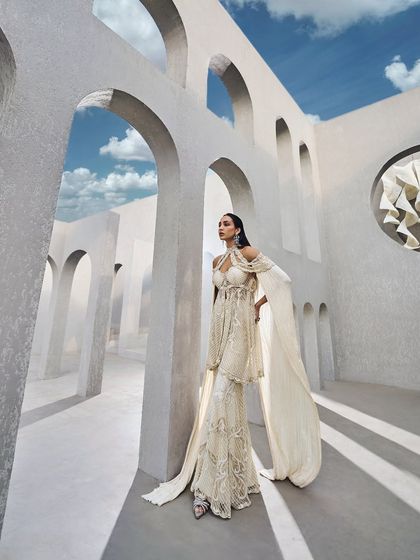 The full silhouette of the ivory sharara set, a dream of bridal couture where shimmer and shine meet timeless glamour.