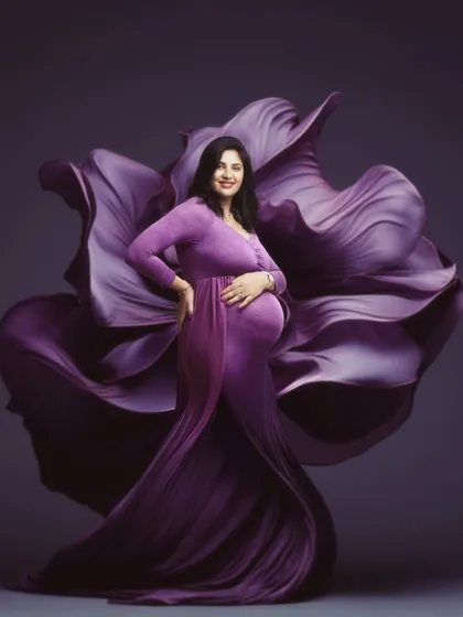 A mother's love, as delicate as a petal yet as powerful as a blooming flower. This portrait is a celebration of the incredible journey of motherhood, transforming a fleeting moment into a piece of timeless art.