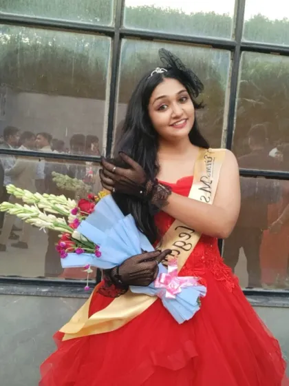 Celebrating a win in style. Our red ball gown was the perfect choice for this "Ms. Elegant" award winner.