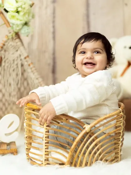 An expressive, happy moment from a first birthday session. We encourage playfulness to capture the most genuine smiles.