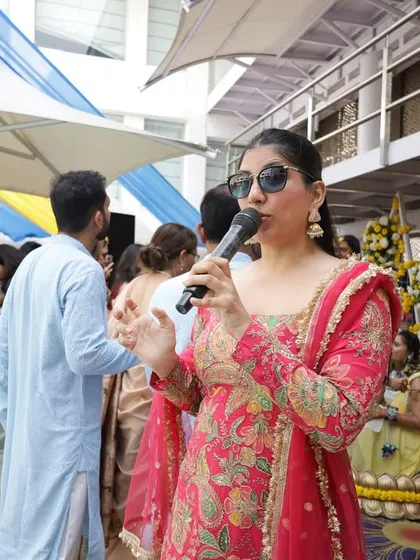 Hosting a poolside Haldi ceremony in a beautiful pink and gold sharara. I adapt my style and energy to fit the unique setting of each event.