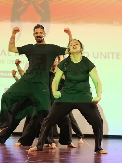 A high-energy moment from our group performance. The expressions on our faces show the passion and power we bring to the stage, fully embodying the story of the piece.
