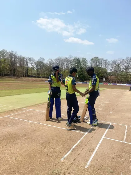 A moment of sportsmanship at the crease as two players from opposing teams shake hands during a match in Goa.