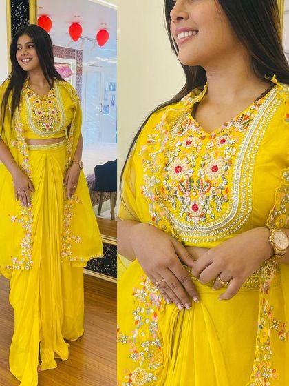 This yellow Indo-Western set with a short shrug is a complete Haldi look. The blouse has beautiful floral embroidery, and the entire outfit is designed to be bright and cheerful.