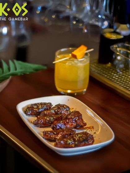 Crispy wings and a chilled drink, the perfect combo. This is how we do game night fuel at K-OS.