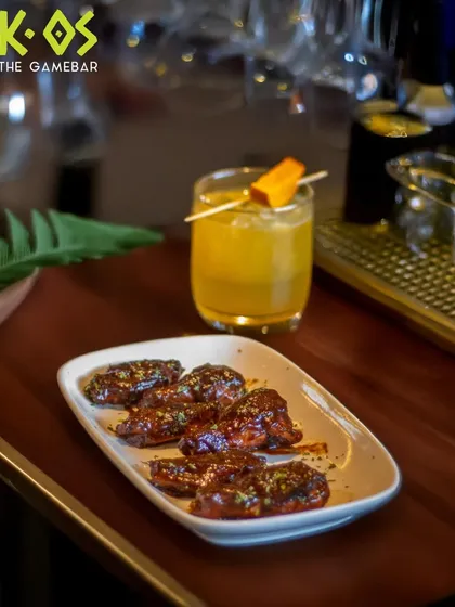 Crispy wings and a chilled drink, the perfect combo. This is how we do game night fuel at K-OS.